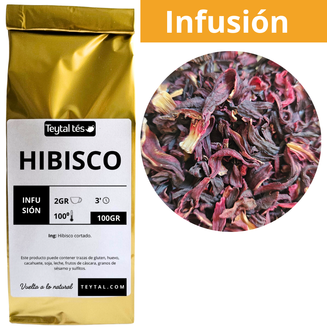 Paquete dorado de 100g de infusión de flor de hibisco con etiqueta blanca y detalles en negro, muestra hibisco seco rojo y.